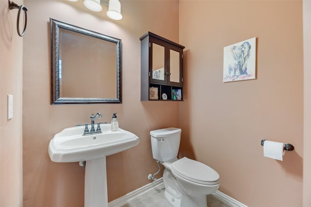 2621 Princeton Dr, Flower Mound, TX 75022 - half bath with baseboards and tile patterned floors