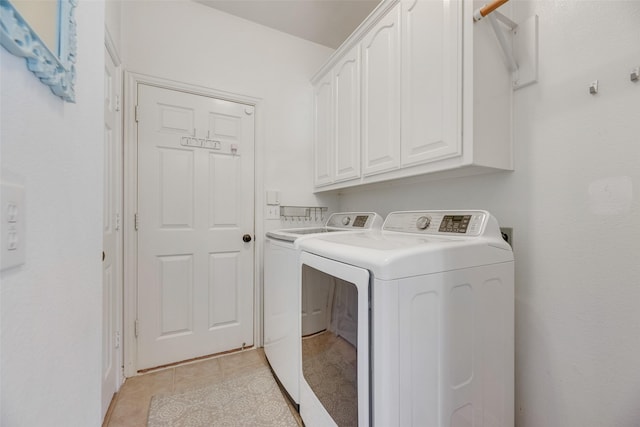 2621 Princeton Dr, Flower Mound, TX 75022 - washroom featuring separate washer and dryer, cabinet space, and light tile patterned floors