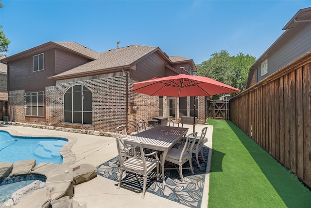 2621 Princeton Dr, Flower Mound, TX 75022 - view of swimming pool featuring a patio area, a gate, and outdoor dining space