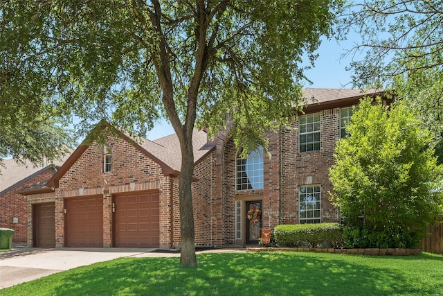 2621 Princeton Dr, Flower Mound, TX 75022 - traditional home with an attached garage, brick siding, concrete driveway, and roof with shingles