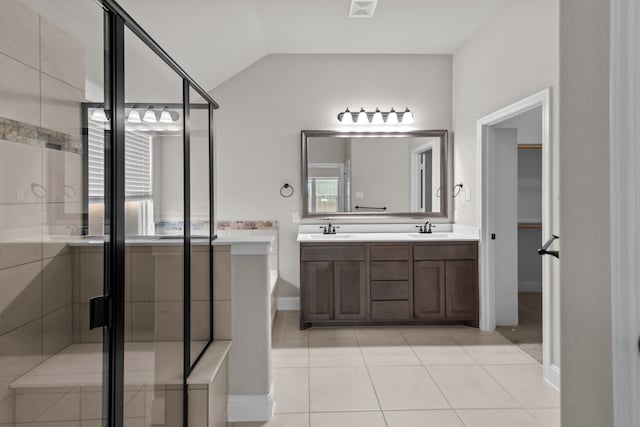 6001 Harwich Ln, Fort Worth, TX 76179 - bathroom featuring double vanity, tile patterned floors, vaulted ceiling, and a stall shower