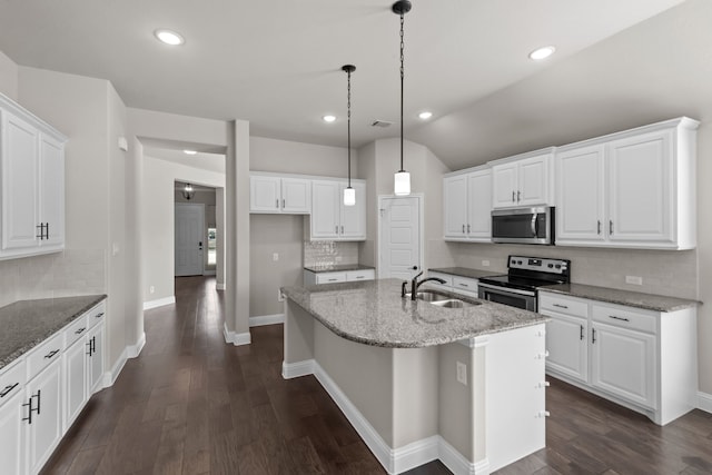 6001 Harwich Ln, Fort Worth, TX 76179 - kitchen with appliances with stainless steel finishes, decorative backsplash, an island with sink, white cabinetry, and light stone countertops