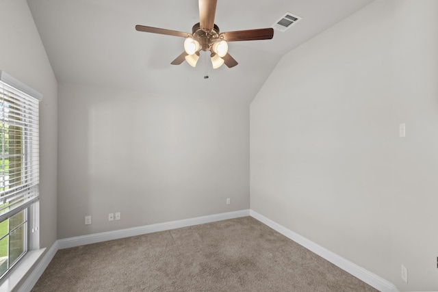 6001 Harwich Ln, Fort Worth, TX 76179 - empty room with lofted ceiling, plenty of natural light, a ceiling fan, and carpet flooring