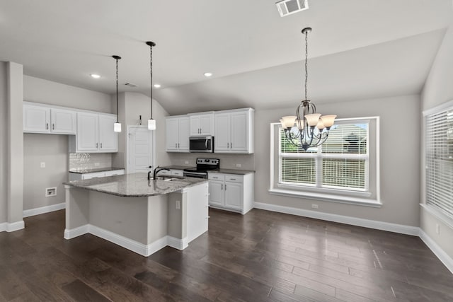 6001 Harwich Ln, Fort Worth, TX 76179 - kitchen featuring stainless steel appliances, vaulted ceiling, white cabinets, a chandelier, and a center island with sink