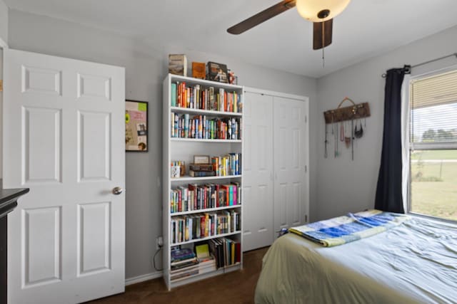 9395 Green Springs Cir, Sanger, TX 76266 - bedroom with dark carpet, a closet, and ceiling fan