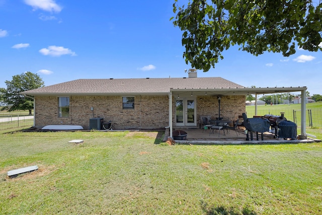 9395 Green Springs Cir, Sanger, TX 76266 - back of property featuring french doors, brick siding, a chimney, a patio area, and roof with shingles