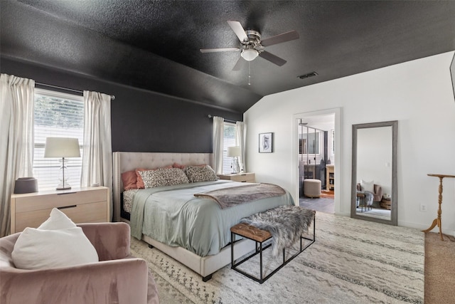 100 Tall Meadow St, Azle, TX 76020 - bedroom featuring carpet floors, vaulted ceiling, a ceiling fan, ensuite bathroom, and a textured ceiling