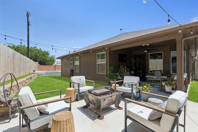 100 Tall Meadow St, Azle, TX 76020 - fenced backyard featuring ceiling fan, a patio, and an outdoor living space with a fire pit