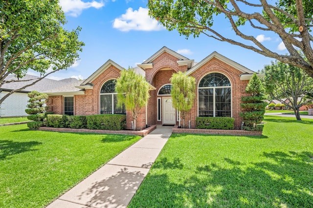 6700 Crane Rd, North Richland Hills, TX 76182 - view of front of house with brick siding and a front yard