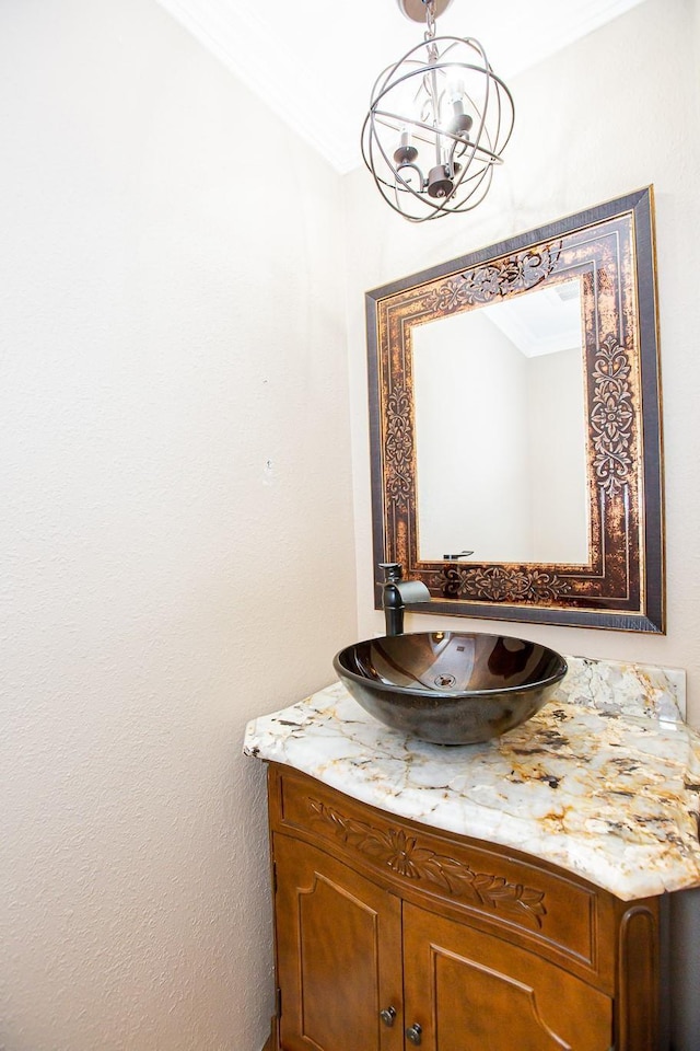 550 Briarwood Dr, Southlake, TX 76092 - bathroom featuring vanity, crown molding, and a chandelier