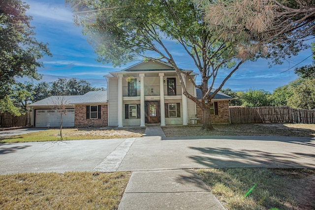 550 Briarwood Dr, Southlake, TX 76092 - greek revival inspired property featuring covered porch, a garage, brick siding, and a balcony