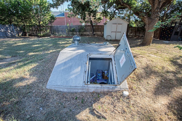 550 Briarwood Dr, Southlake, TX 76092 - entry to storm shelter featuring a storage unit and a fenced backyard