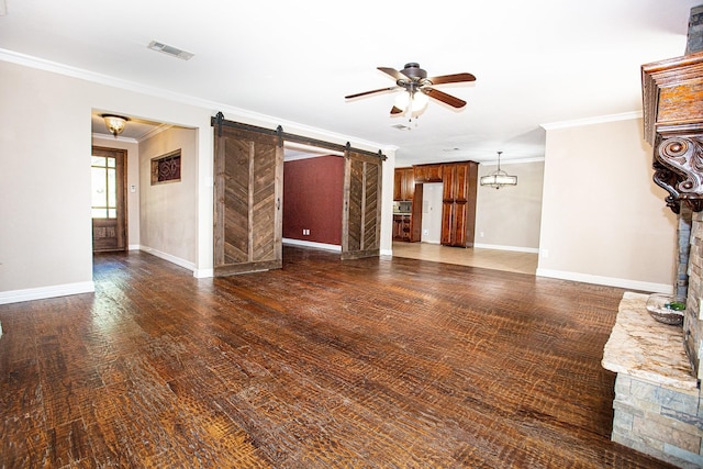 550 Briarwood Dr, Southlake, TX 76092 - unfurnished living room with a ceiling fan, a barn door, crown molding, and wood finished floors
