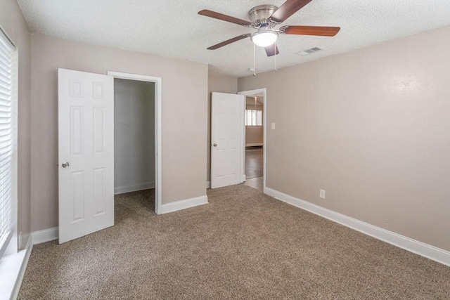 6708 Fair Meadows Dr, North Richland Hills, TX 76182 - unfurnished bedroom featuring carpet, a textured ceiling, and a ceiling fan