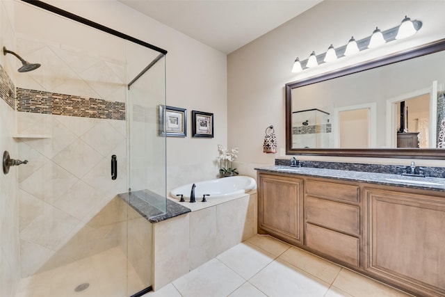 5005 Parkplace Dr, Denton, TX 76226 - bathroom with a bath, a shower stall, tile patterned floors, and double vanity