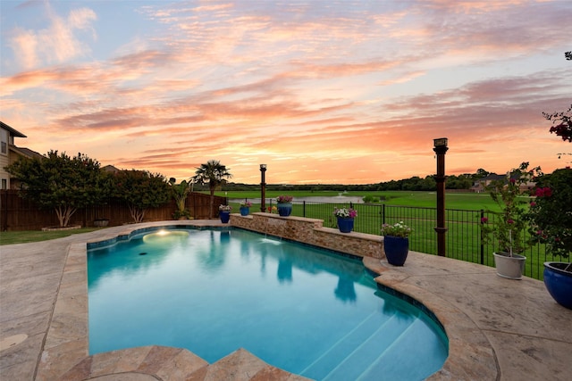 5005 Parkplace Dr, Denton, TX 76226 - pool at dusk with a fenced backyard and a patio area