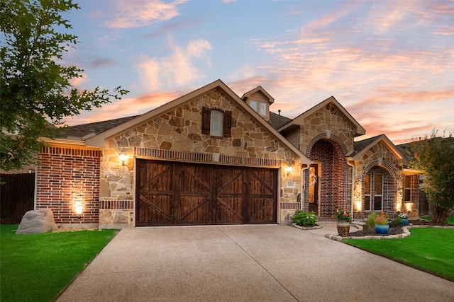 5005 Parkplace Dr, Denton, TX 76226 - french country inspired facade with stone siding, a garage, concrete driveway, and a front yard