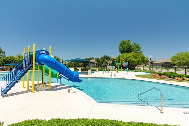 1104 Cheyenne Dr, Aubrey, TX 76227 - community pool featuring a water slide and a water play area