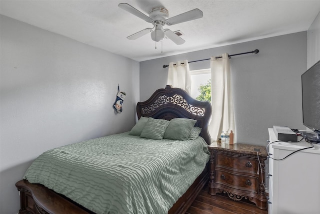 2304 Spanish Trl, Irving, TX 75060 - bedroom with wood finished floors and a ceiling fan