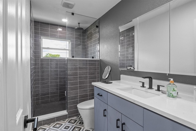 2304 Spanish Trl, Irving, TX 75060 - full bathroom with a textured wall, vanity, and tiled shower