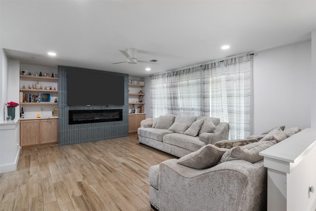 2304 Spanish Trl, Irving, TX 75060 - living area with ceiling fan, light wood finished floors, a fireplace, and recessed lighting