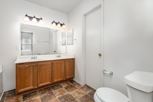 1428 Nimitz Way, Mesquite, TX 75181 - bathroom featuring double vanity and stone finish floors