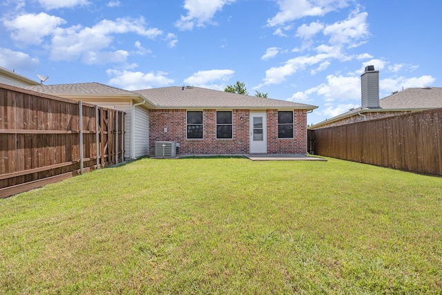 1428 Nimitz Way, Mesquite, TX 75181 - rear view of house with brick siding, a fenced backyard, and roof with shingles