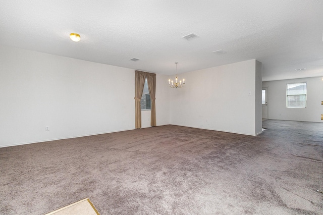 1428 Nimitz Way, Mesquite, TX 75181 - spare room featuring a chandelier and carpet