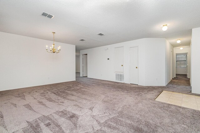 1428 Nimitz Way, Mesquite, TX 75181 - unfurnished room with carpet floors, a chandelier, and a textured ceiling