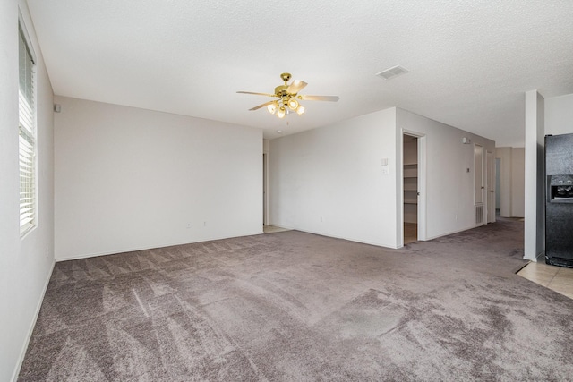 1428 Nimitz Way, Mesquite, TX 75181 - carpeted spare room with ceiling fan and a textured ceiling