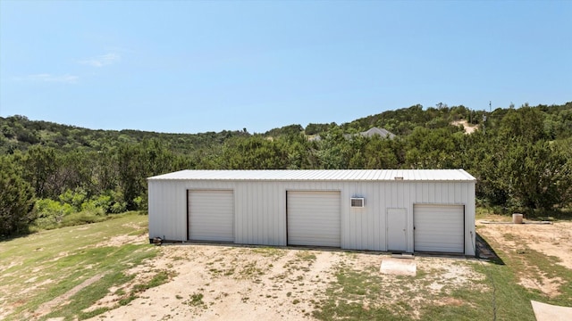 2030 Hills Ct, Stephenville, TX 76401 - detached garage with a view of trees