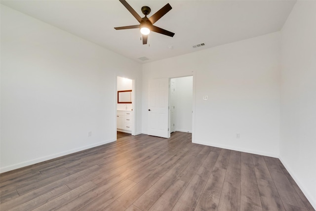 13625 Musselshell Dr, Ponder, TX 76259 - unfurnished bedroom with wood finished floors, ceiling fan, and ensuite bath