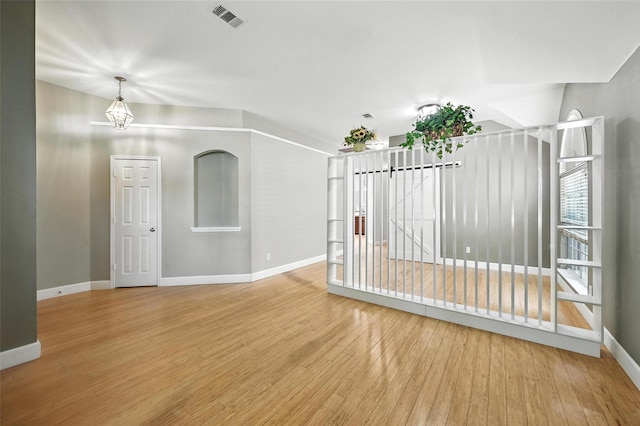 4917 Summer Oaks Ln, Fort Worth, TX 76123 - spare room featuring wood finished floors and a chandelier