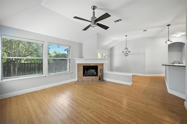 4917 Summer Oaks Ln, Fort Worth, TX 76123 - unfurnished living room with lofted ceiling, a fireplace, light wood-type flooring, and ceiling fan