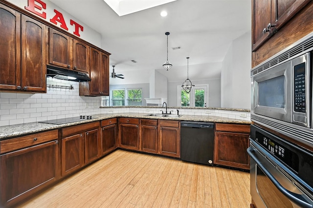 4917 Summer Oaks Ln, Fort Worth, TX 76123 - kitchen with black appliances, under cabinet range hood, light wood-type flooring, backsplash, and ceiling fan