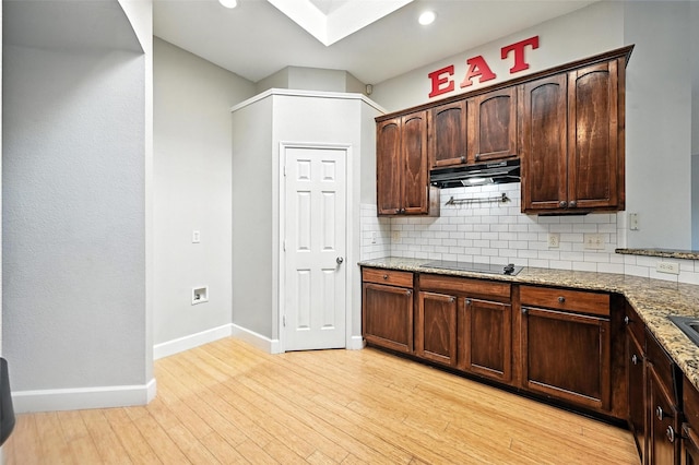 4917 Summer Oaks Ln, Fort Worth, TX 76123 - kitchen featuring black electric cooktop, tasteful backsplash, light stone countertops, and recessed lighting