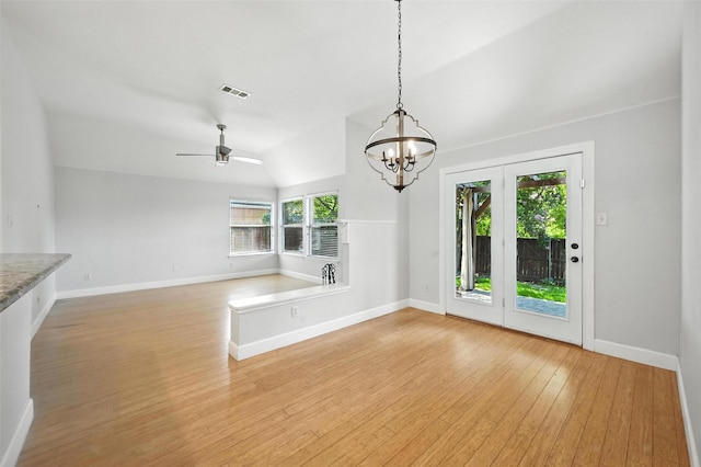 4917 Summer Oaks Ln, Fort Worth, TX 76123 - unfurnished dining area featuring light wood finished floors, a chandelier, ceiling fan, and vaulted ceiling