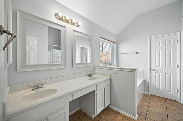 4917 Summer Oaks Ln, Fort Worth, TX 76123 - bathroom with lofted ceiling, double vanity, a bath, and tile patterned flooring