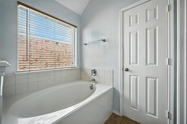 4917 Summer Oaks Ln, Fort Worth, TX 76123 - bathroom with a bath, tile patterned flooring, and lofted ceiling