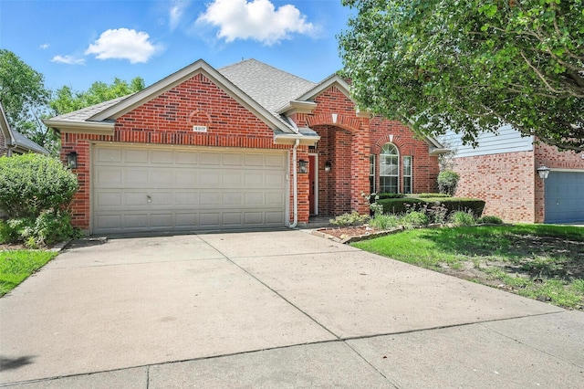 4917 Summer Oaks Ln, Fort Worth, TX 76123 - traditional home with brick siding, concrete driveway, an attached garage, and roof with shingles