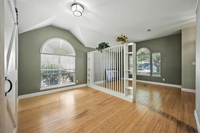 4917 Summer Oaks Ln, Fort Worth, TX 76123 - spare room with wood-type flooring and lofted ceiling