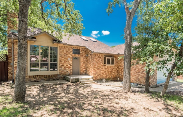 4300 Hidden Creek Dr, Arlington, TX 76016 - ranch-style home with roof with shingles, brick siding, and an attached garage