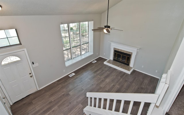 4300 Hidden Creek Dr, Arlington, TX 76016 - entrance foyer featuring ceiling fan, a tile fireplace, dark wood-type flooring, and vaulted ceiling