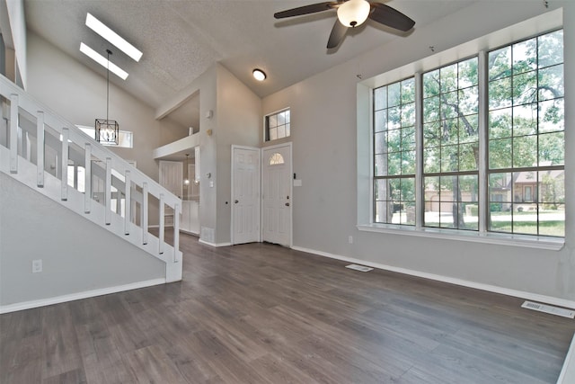 4300 Hidden Creek Dr, Arlington, TX 76016 - entrance foyer with healthy amount of natural light, a ceiling fan, dark wood finished floors, a skylight, and a textured ceiling
