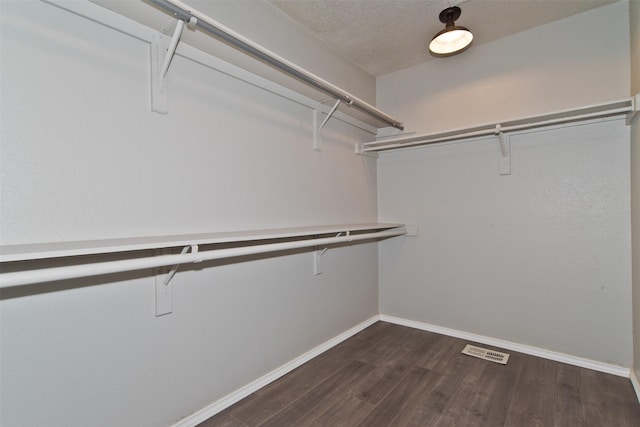 4300 Hidden Creek Dr, Arlington, TX 76016 - spacious closet featuring dark wood-style flooring