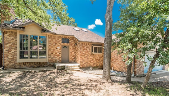 4300 Hidden Creek Dr, Arlington, TX 76016 - view of front facade featuring brick siding and a shingled roof