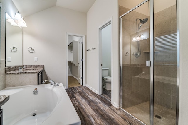 1304 Meridian Dr, Forney, TX 75126 - full bath with a shower stall, vanity, a garden tub, wood finished floors, and lofted ceiling