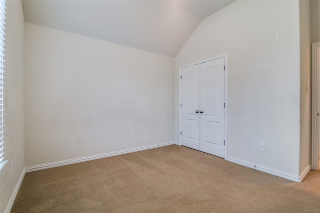 1304 Meridian Dr, Forney, TX 75126 - unfurnished bedroom with carpet flooring, lofted ceiling, and a closet