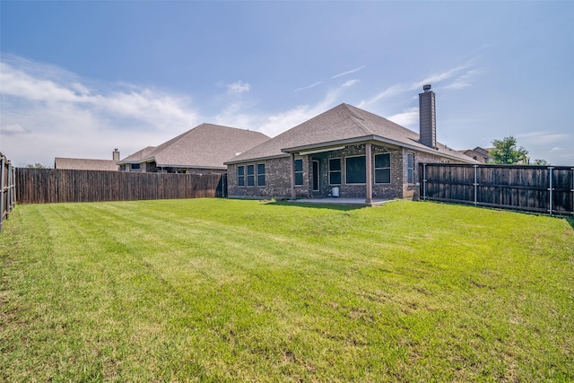 1304 Meridian Dr, Forney, TX 75126 - rear view of house featuring a patio area, a fenced backyard, and a chimney