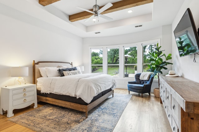 4705 Clydesdale Dr, Flower Mound, TX 75028 - bedroom with light wood-style floors, beam ceiling, ceiling fan, recessed lighting, and a raised ceiling